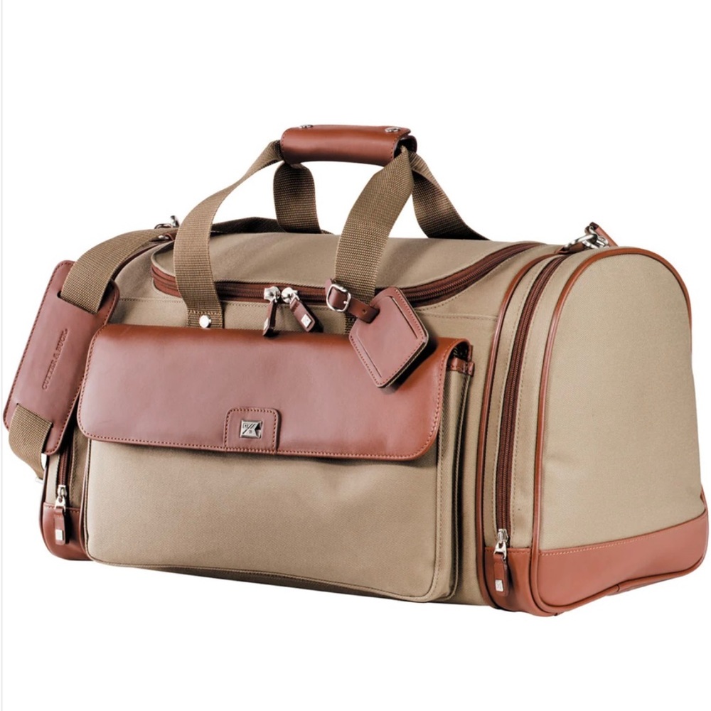 Duffel bag. Smooth leather fabric, adjustable shoulder strap, leather trim